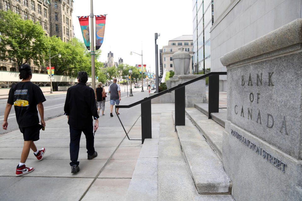 Pedestrians walk past the Bank of Canada in Ottawa, Ontario, Canada, on July 12, 2023. On July 12, 2023, Canada's central bank raised its key interest rate by 25 basis points to five percent, the highest level since 2001. Acknowledging that global inflation was easing, the Bank of Canada explained its decision -- which was in line with analysts' expectations -- saying: