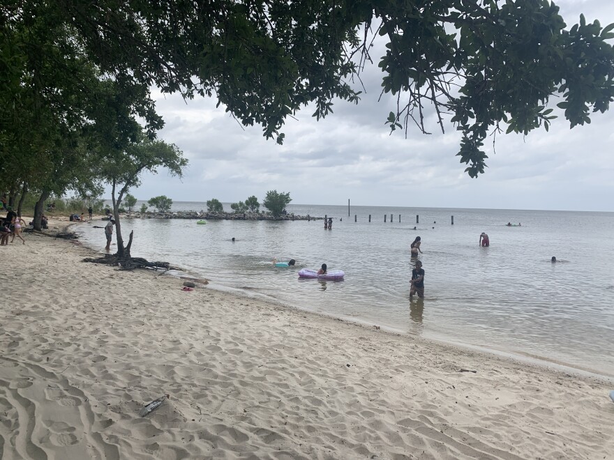 Families enjoy the water at Lincoln Beach in New Orleans East on April 27. A new survey finds strong support for conservation and outdoor recreation among Latino residents of the Mississippi River Basin, which includes New Orleans.